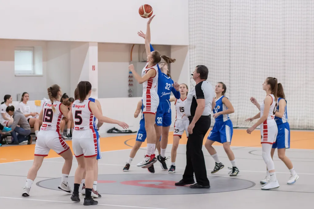 Two Female teams tackling the Basketball