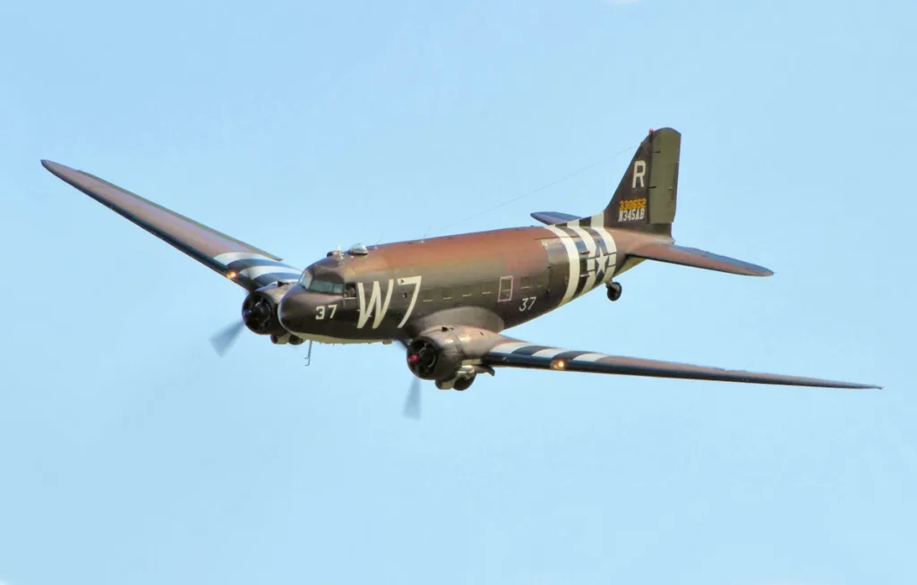 Iconic 330652 Douglas C-47 Skytrain in brownish Teal flying high