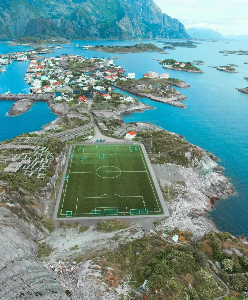 Soccer field Soccer Result Forecasts Panoramic aerial view of soccer pitch and islets, Henningsvaer, Vagan municipality, Lofoten Islands, Nordland, Norway, Europe