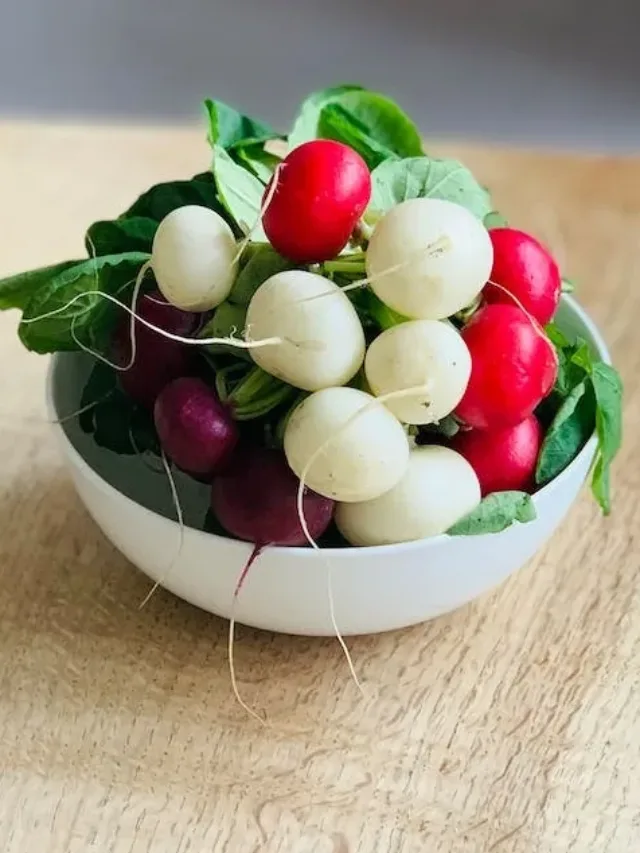 white bowl full of white, red, purple and green vegetables called super food