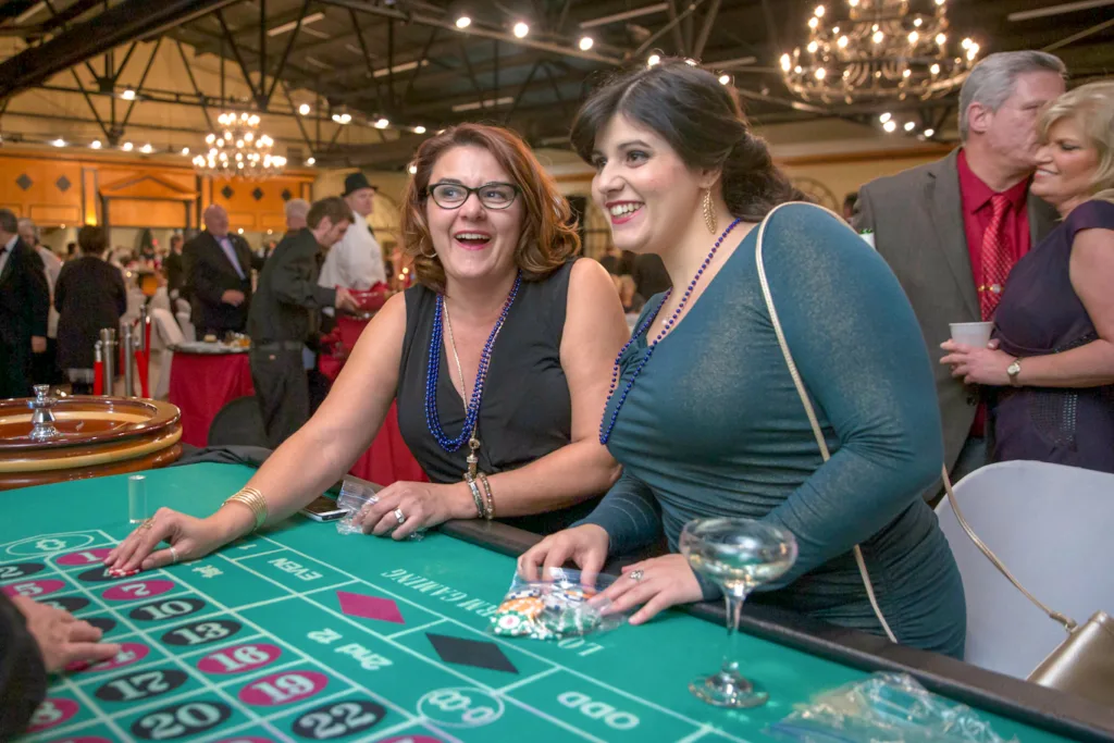 two woman playing inside a casino