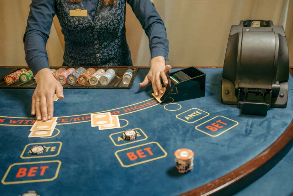 woman randomly removing and laying cards on the casino table
