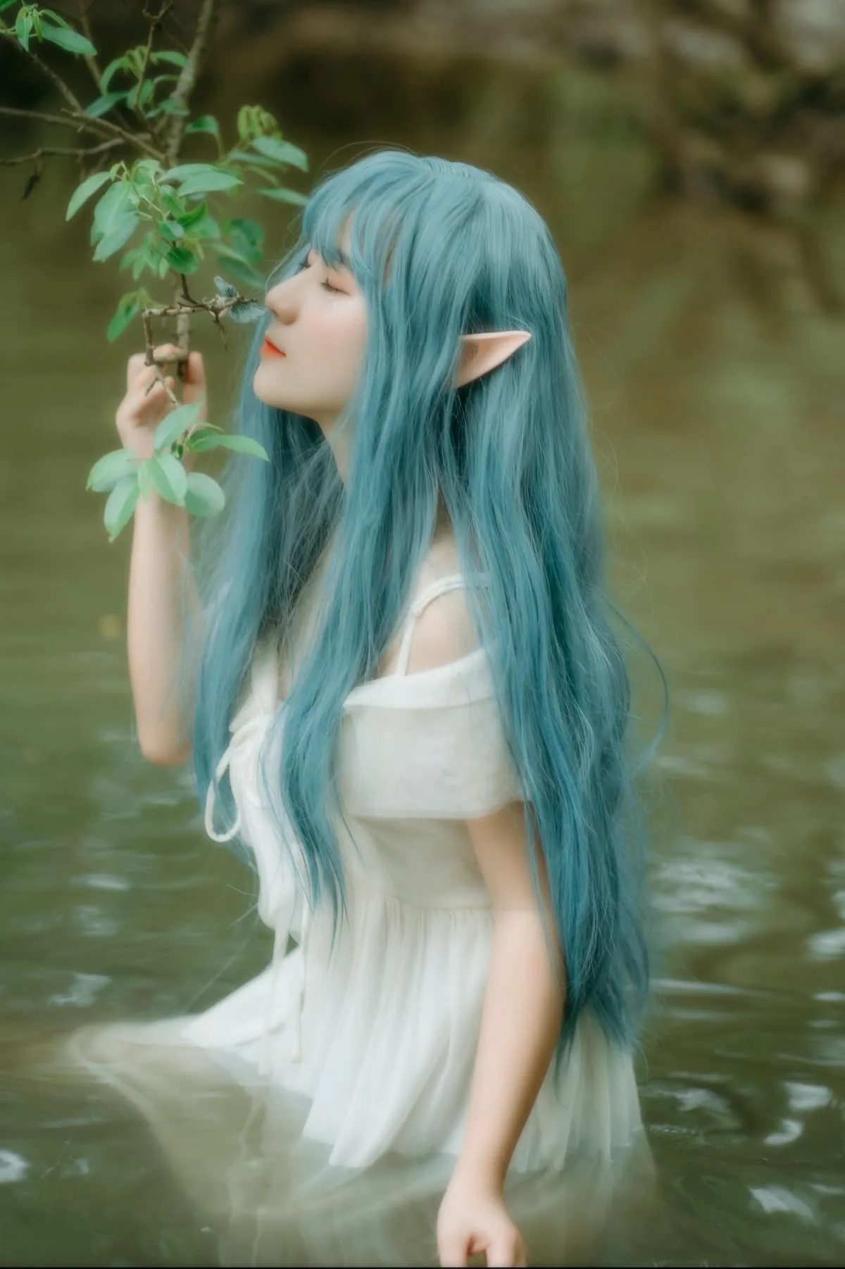 a beautiful girl with blue hair and elf years sitting in water with closed eyes holding a tree branch