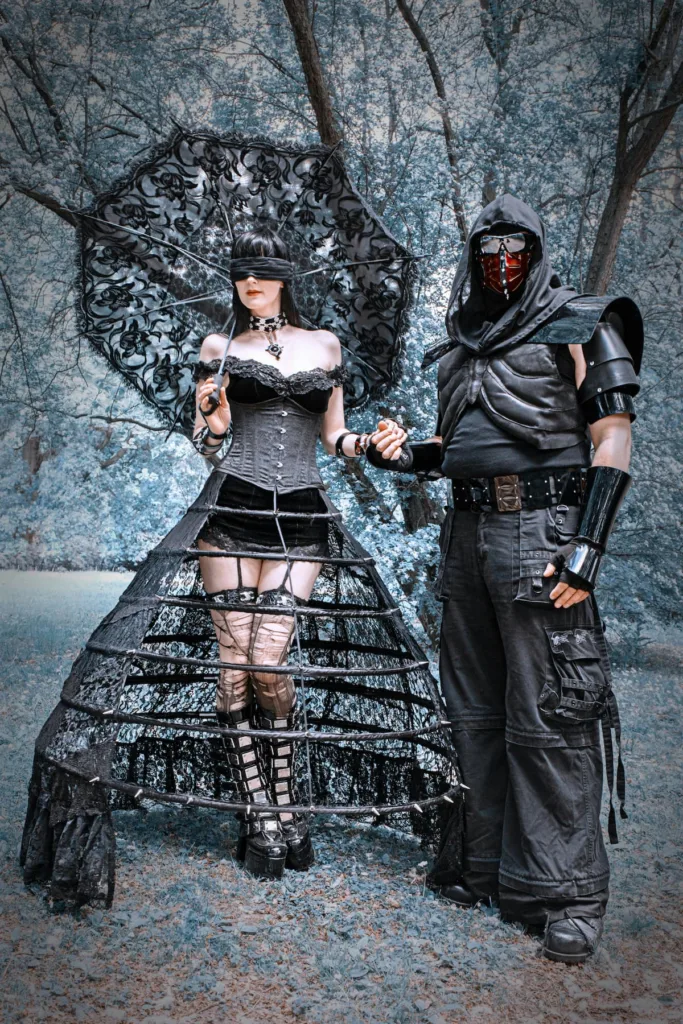 woman and man i cosplay, woman holding a black umbrella and man with covered face mask