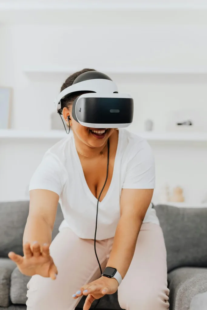 A woman in white V shaped T shirt wearing VR box