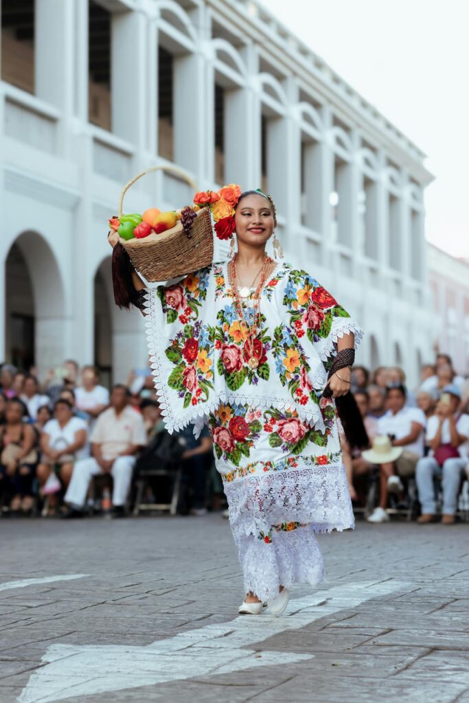 beautiful woman dressed up in nice costume performing on street with basket of fruits on shoulder