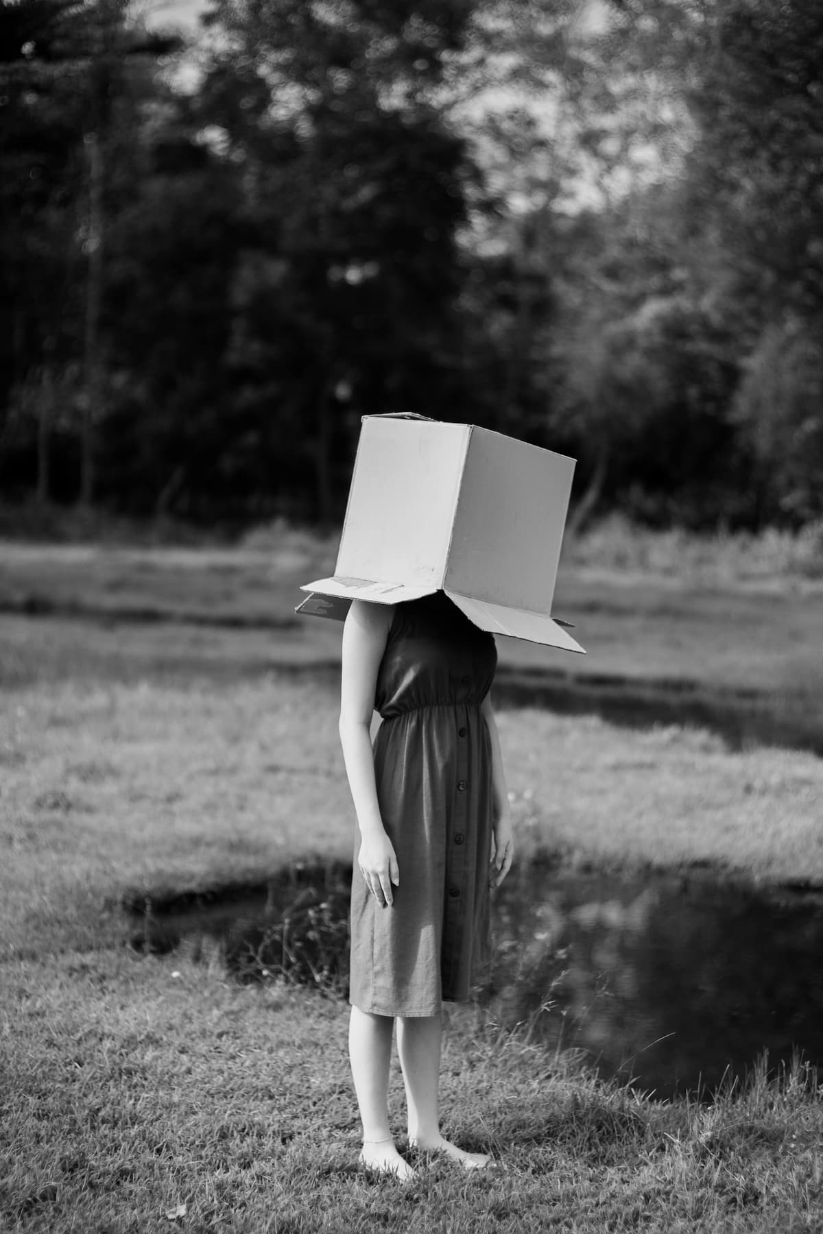 woman standing with box put on her head