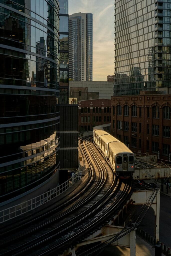 a train passing through buildings on an elevated track
